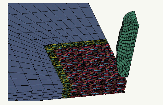 Simulation of a ballistic impact of a deformable bullet upon a multilayer fabric package